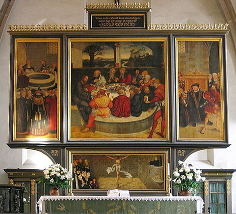 A triptych altarpiece. The left panel depicts a baptism. The right panel depicts a confession. The center panel depicts the last supper. In a painting below the triptych, we see the crucifix.