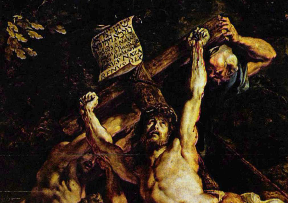 Detalle del rostro de Cristo y un hombre en la parte superior de la cruz.