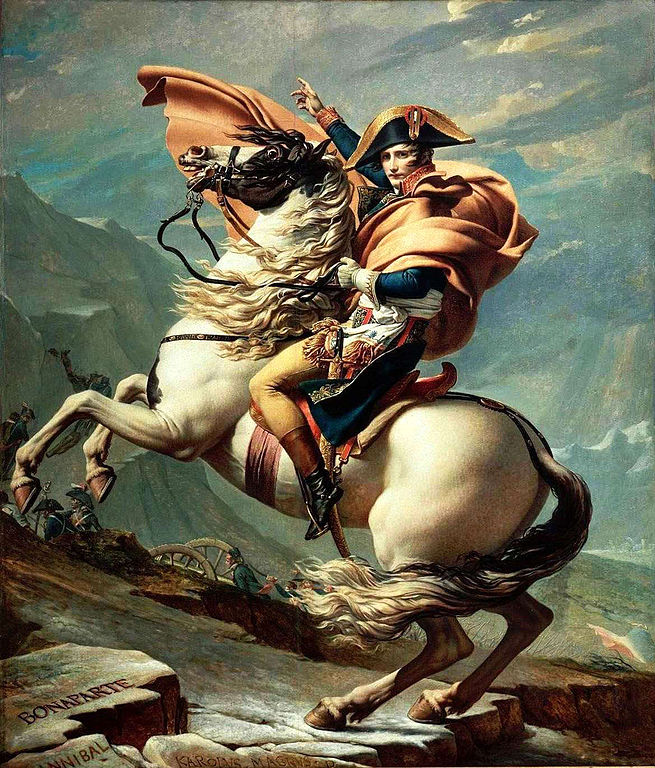 Napoleon on horseback. The horse is rearing up on its hind legs, and Napoleon is pointing off into the distance. His gaze is straight at the viewer of the painting.