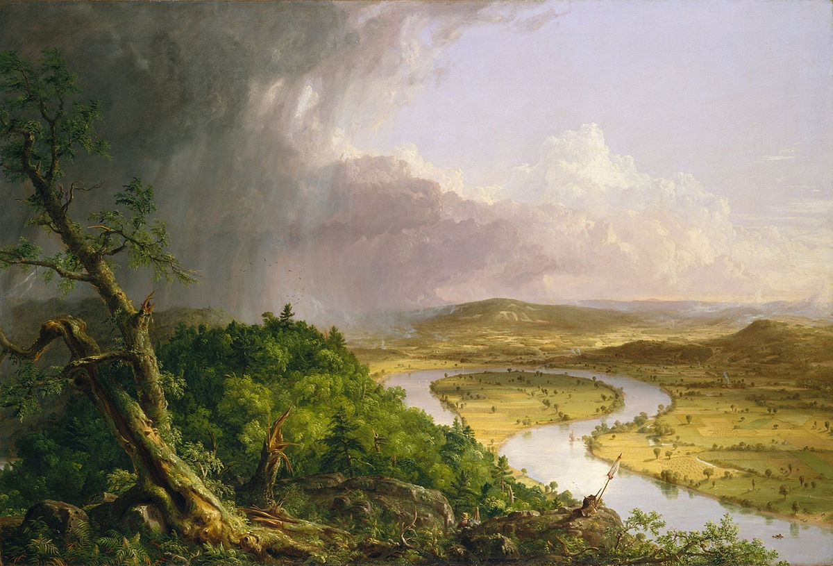 The foreground contains a rich green hill with trees and rain clouds above it. In the background is a green grassy field with a river. The river makes almost a complete circle, but both ends of the river part.