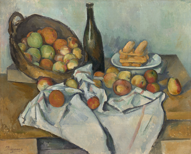 The basket of apples rests on its side in the left background of the painting. Some apples have spilled out of the basket onto a white cloth in front of the basket. A bottle and plate of bread stands next to the basket in the background.
