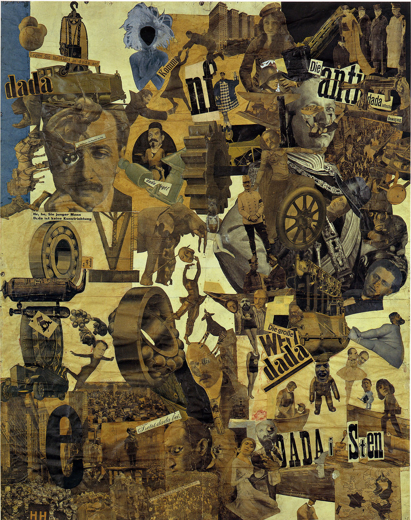 A collage work. The word dada appears three different times. The other images are an assortment of people, crowds, and man made times, such as wheels and buildings. The collage is primarily newsprint faded to browns and yellows, but near the top left, there is a blue woman whose face has been covered with a black rounded shape.