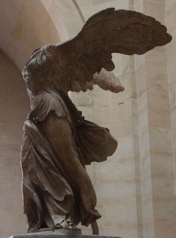 A winged woman. Over time, the head of the sculpture has been lost.