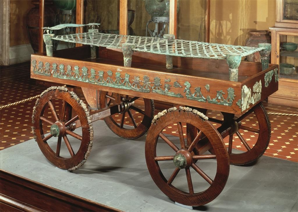 The bed is on a wheeled carriage.