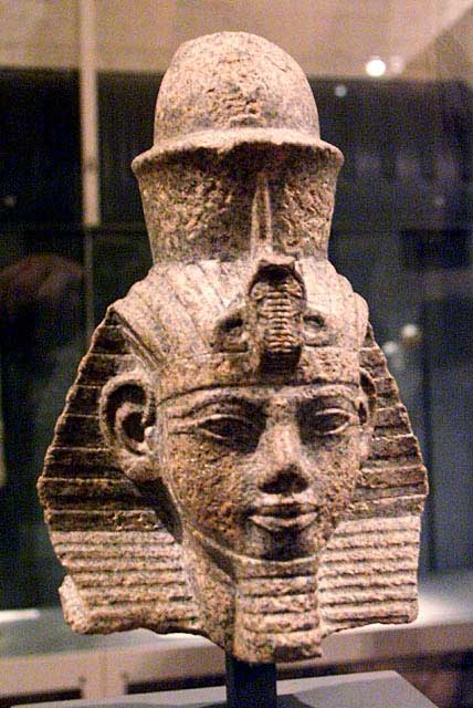 Sculpture depicts the head of Amenhotep the Magnificent, an Egyptian pharaoh. He wears a pharaoh's crown.