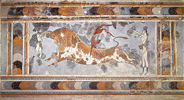 This is a color photograph of Bull Leaping, a fresco found on an upper story of the palace at Knossos, Crete, Greece. Circa 1450–1400 BCE. On either side of the leaping bull are human figures.