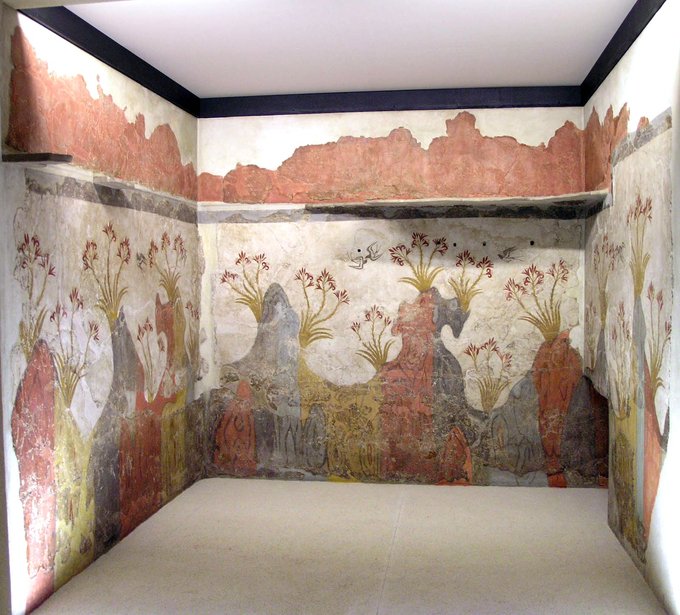 This is a color photograph of the wall painting, which features a landscape of tall flowers with birds flying above them.