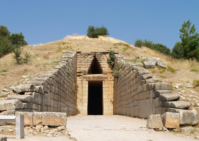 This is a color photo of the Treasury of Atreus, Mycenae, Greece, circa 1300–1250 BCE. The Treasury of Atreus and others tombs like it are demonstrations of corbeled vaulting that covers an expansive open space.