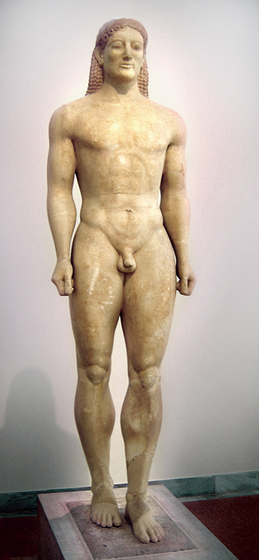 Color photo of a nude free-standing male sculpture. The face bears a slight smile.