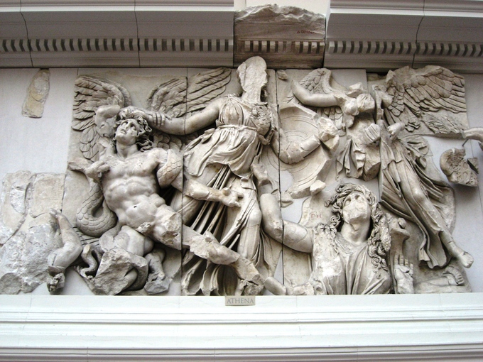 This is a photo of the frieze depicting Athena and Alkyoneos. Athena grabs the hair of the giant Alkyoneos as Nike flies to crown her.