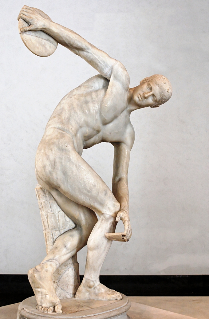 This is a photo of Diskobols. It is a statue of a male figure preparing to throw the disk in his hand.