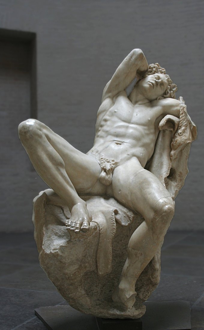 This is a photo of the statue the Barberini Faun. It depicts a nude male, seated with his legs spread and his arm behind his head.