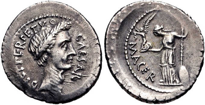 These photos show both sides a denarius, a round silver coin used for Roman currency. One side shows a portrait of Julius Caesar in profile wearing a laurel crown. The other side shows love and fertility goddess Venus. She wears a toga that exposes part of her chest and hold a winged victory—a female figure depicting a classical goddess.