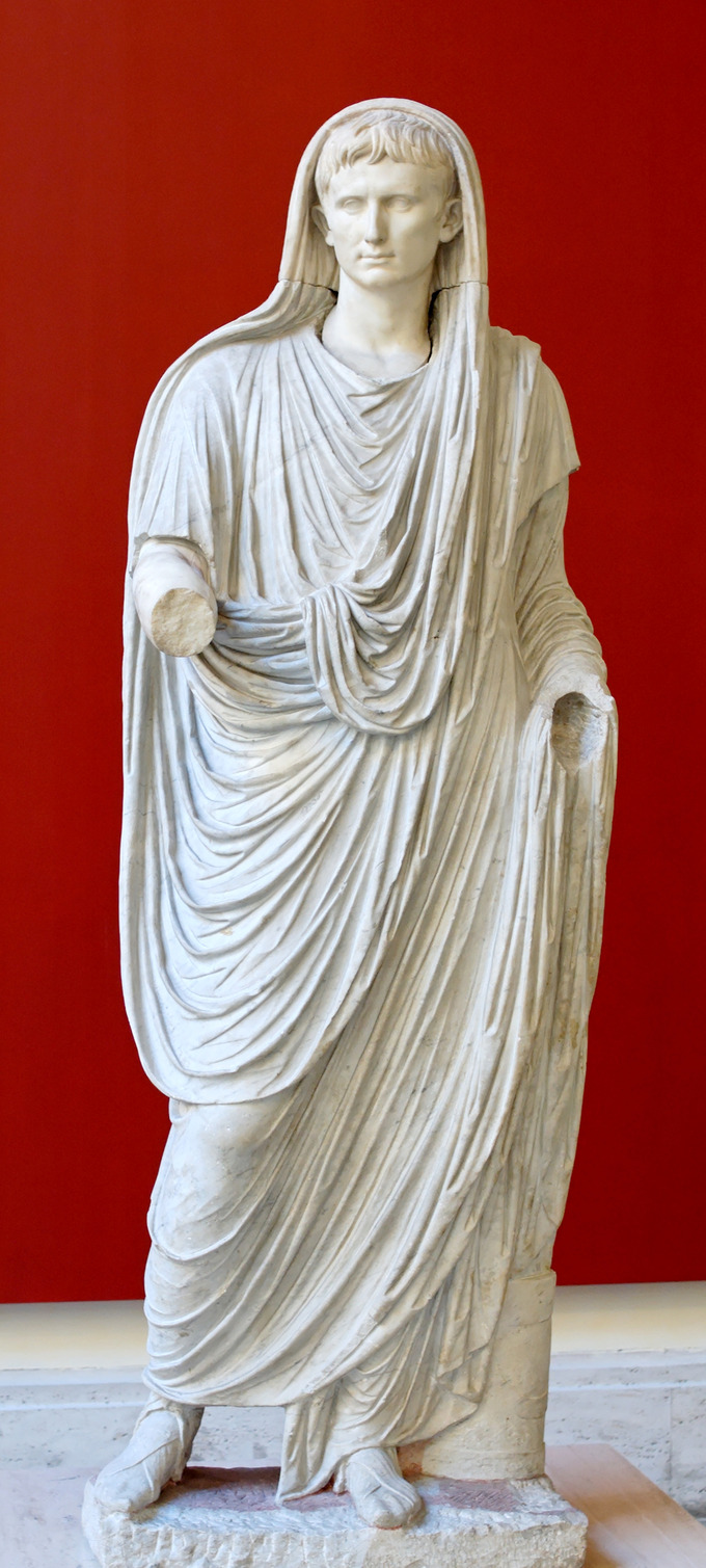 This photo shows a statue of Augustus portrayed as Pontifex Maximus, dressed in a toga that covers his head.
