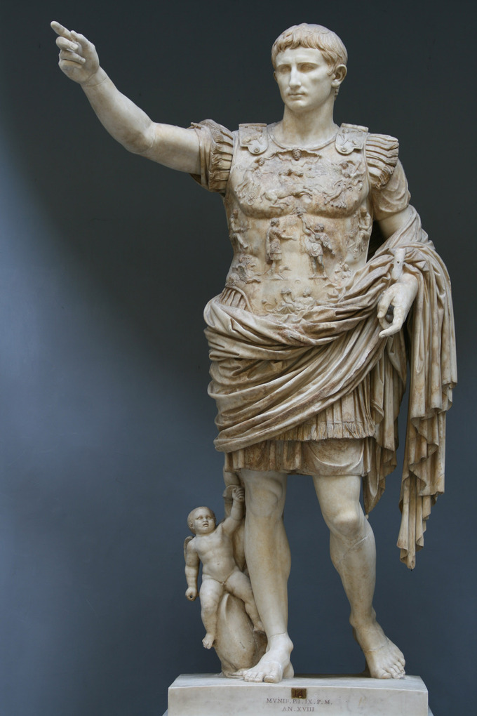 This photo shows the Augustus of Primaporta statue. He solutes the army in a contrapposto stance wearing a breastplate and battle garb.