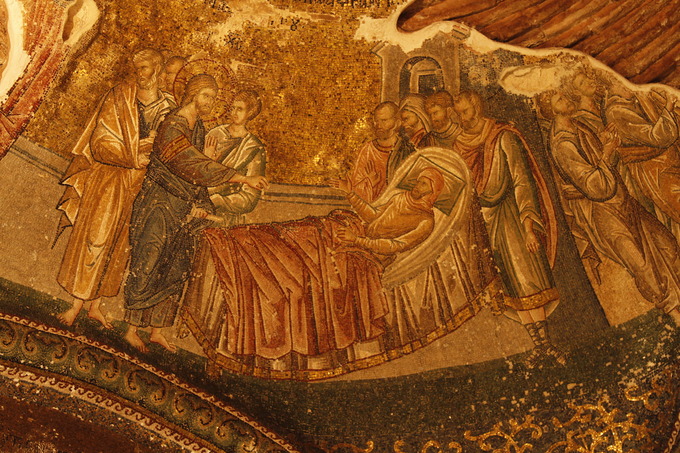 This is a photo of the mosaic Christ Healing a Paralytic. It depicts Christ standing over the bed of a patient, reaching toward him.