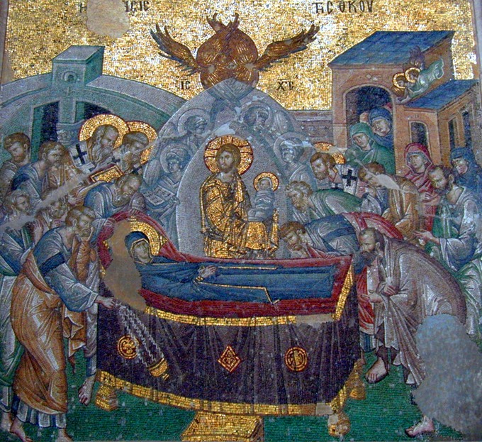 This photo shows the Koimesis mosaic. In the center, Jesus holds an infant representing the soul of the Virgin. Around him, are angels and a six-winged seraph. At Mary's head, is Saint Peter and at her feet, Saint Paul.