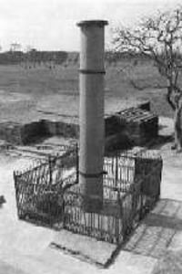 This is a current-day black and white photo of a Pillar of Ashoka at Lumbini.