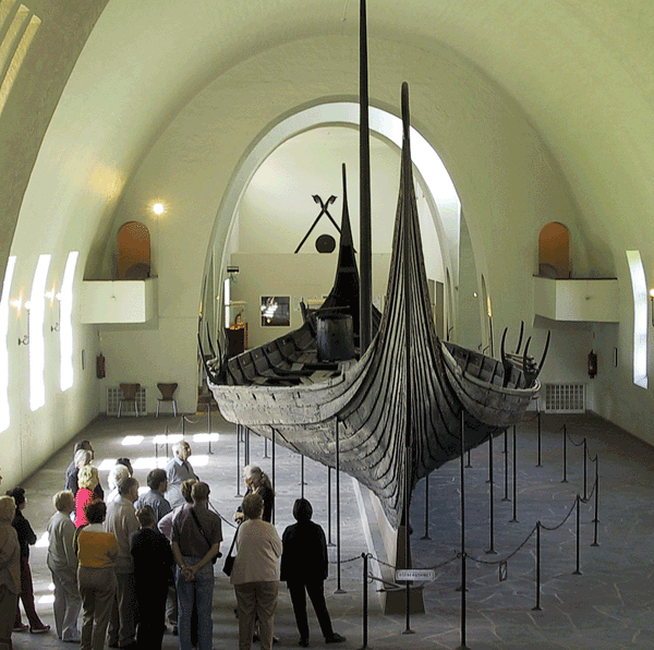 Image of a group of people viewing the ship in a museum.