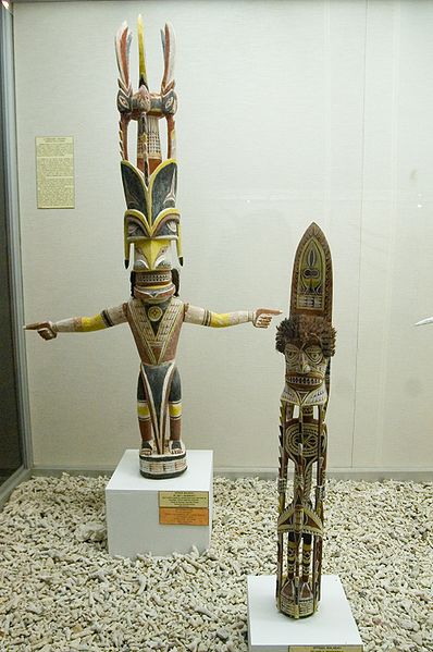 Two intricately designed and decorated statues.