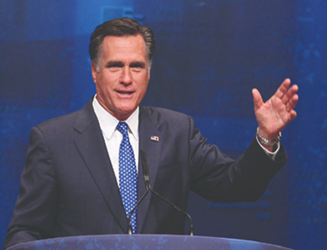 A photograph shows Mitt Romney speaking at a lectern.