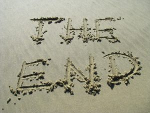 The words "the end" written in sand.