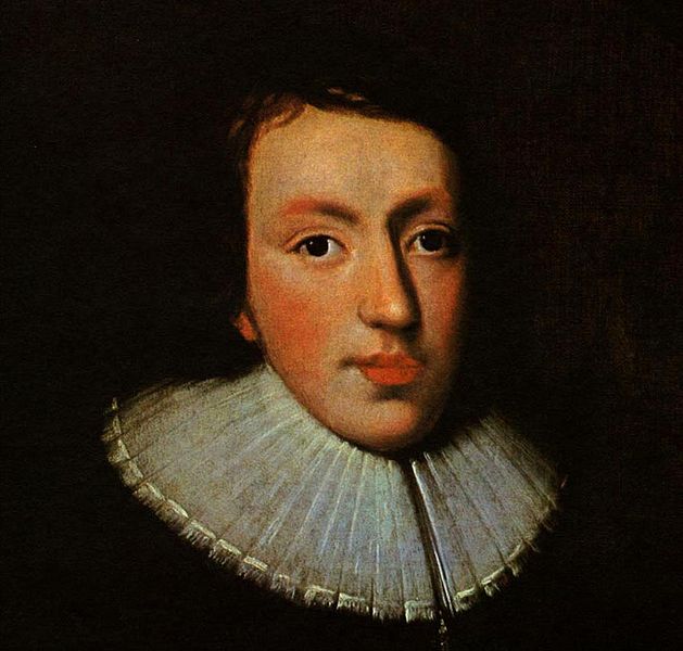 Oil painting of John Milton as a young man. His hair is dark and blends in with the background. He is clean-shaven with rosy cheeks and lips, and wears a ruffled white collar on dark clothing.