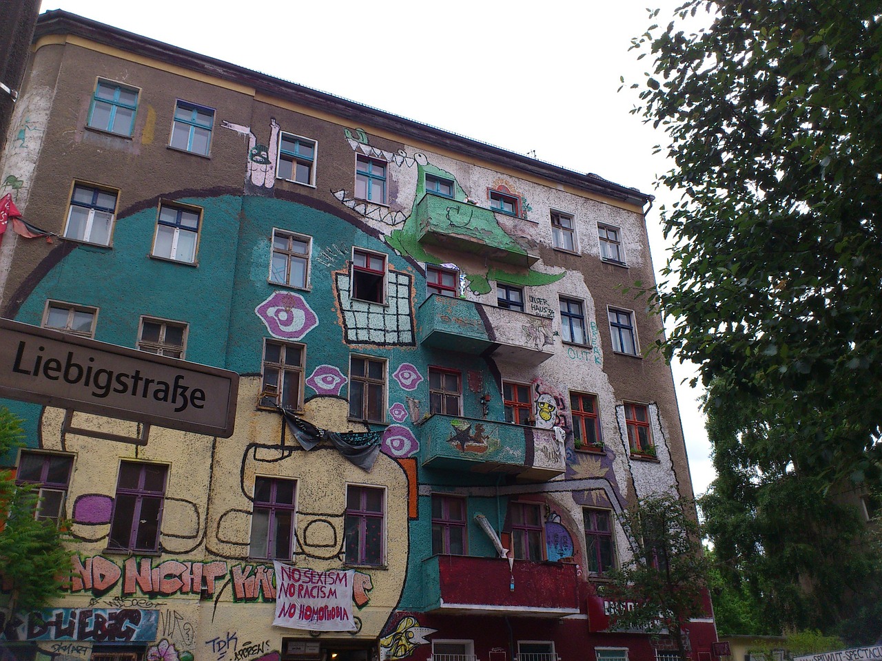 A building covered in graffiti from a neighborhood in Berlin