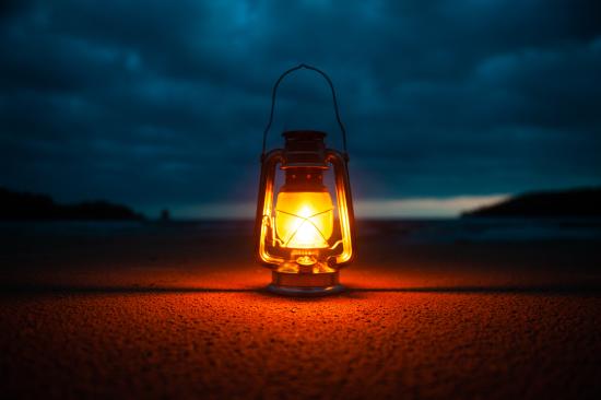 a lamp lit in the dark
