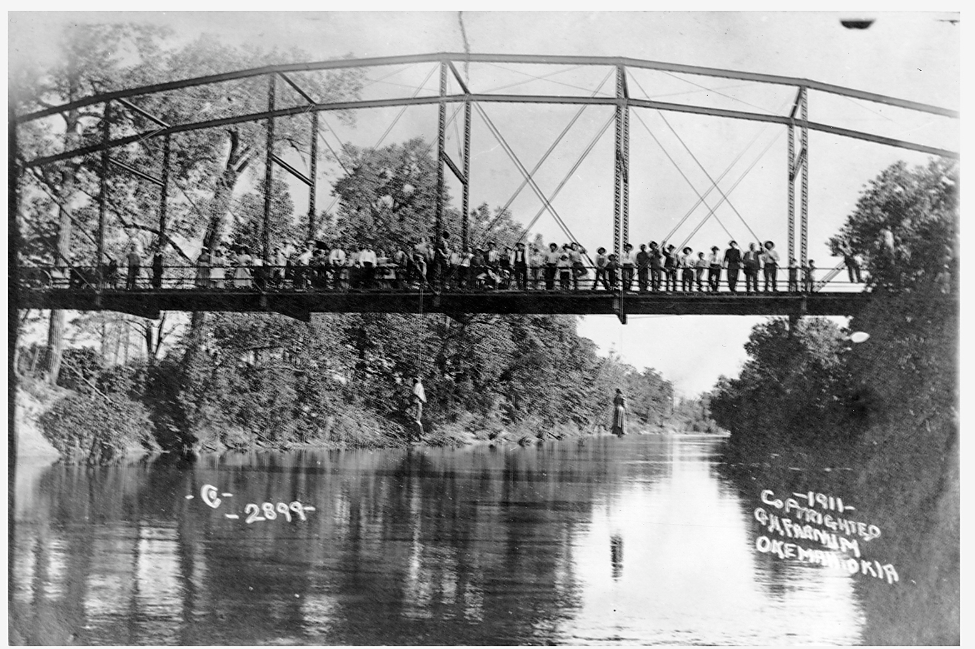 This photograph shows the lynching of Laura and Lawrence Nelson on May 25, 1911 in Okemah, Oklahoma. One of thousands of lynchings throughout the South in the late nineteenth and century twentieth centuries, this particular case of the lynching of a mother and son garnered national attention. In response, the local white newspaper in Okemah simply wrote, “while the general sentiment is adverse to the method, it is generally thought that the negroes got what would have been due them under due process of law." (The Okemah Ledger, May 4, 1911) George H. Farnum (photographer), Photograph, May 25, 1911. Wikimedia, http://commons.wikimedia.org/wiki/File:Lynching_of_Laura_Nelson_and_her_son_2.jpg. 