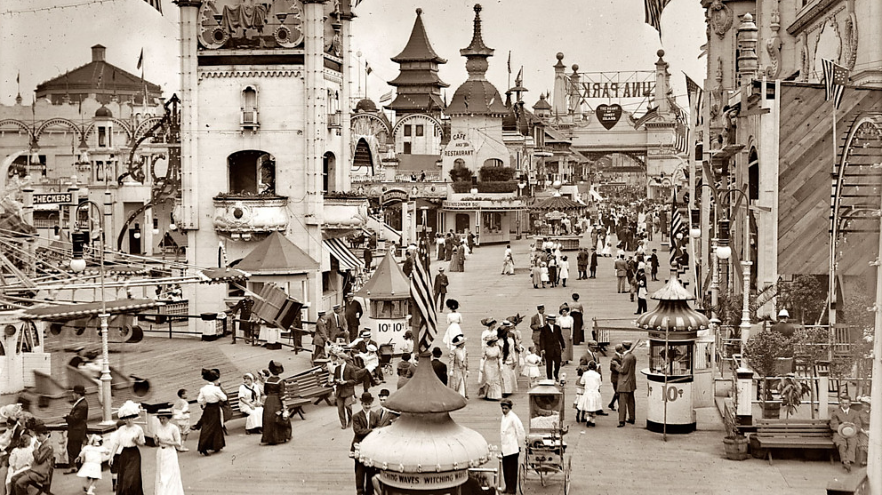 Amusement-hungry Americans flocked to new entertainments at the turn of the twentieth century. In this early-twentieth century photograph, visitors enjoy Luna Park, one of the original amusement parks on Brooklyn's famous Coney Island. Visitors to Coney Island's Luna Park, ca.1910-1915. Via Library of Congress (LC-B2- 2240-13).