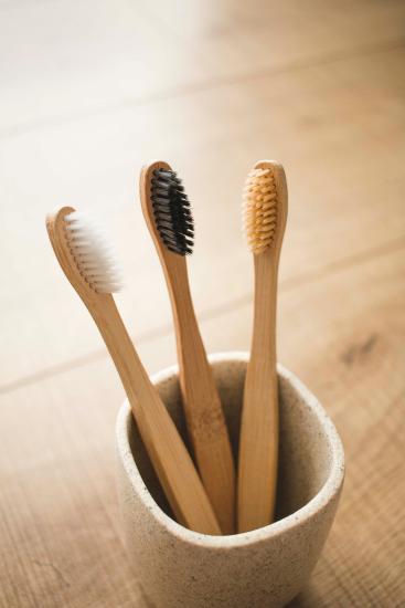 compostable toothbrushes in a jar