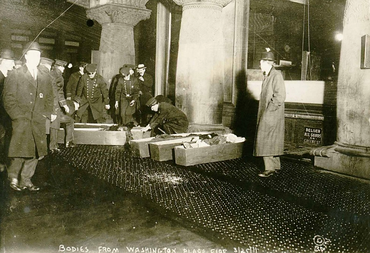 Photographs like this one made real the potential atrocities resulting from unsafe working conditions, as policemen place the bodies of workers burnt alive in the 1911 Triangle Shirtwaist fire into coffins. “Bodies from Washington Place fire, Mar 1911,” March 25, 1911. Library of Congress, http://www.loc.gov/pictures/item/98502780/. 
