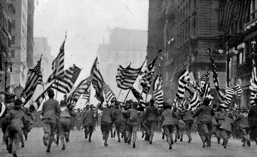 Moments like this – with the Boy Scouts of America charging up Fifth Avenue in New York City with flags in their hands – signaled to Americans that it was time to wake up to the reality of war and support the effort in any way possible. "Wake Up, America" parades like this one were throughout the country in support of recruitment. Nearly 60,000 people attended this single parade in New York City. Photograph from National Geographics Magazine, 1917. Wikimedia, http://commons.wikimedia.org/wiki/File:Boy_Scouts_NGM-v31-p359.jpg.