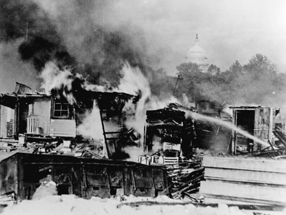 “Shacks, put up by the Bonus Army on the Anacostia flats, Washington, D.C., burning after the battle with the military. The Capitol in the background. 1932.” Wikimedia, http://commons.wikimedia.org/wiki/File:Evictbonusarmy.jpg. 