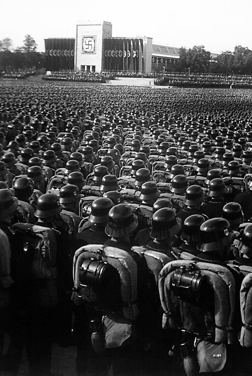 Huge rallies like this one in Nuremberg displayed the sheer number of armed and ready troop and instilled a fierce loyalty to (or fearful silence about) Hitler and the National Socialist Party in Germany. Photograph, November, 9. 1935. Wikimedia, http://commons.wikimedia.org/wiki/File:Reichsparteitag_1935.jpg.