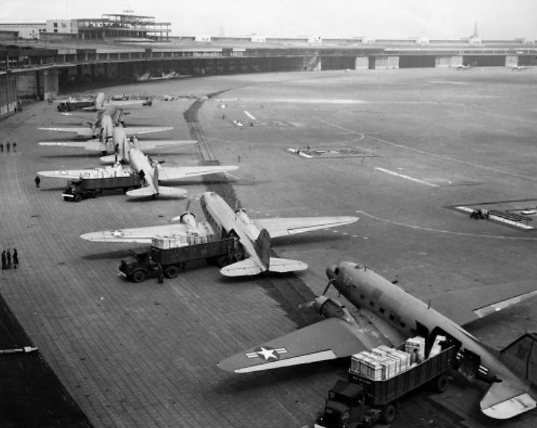 The Berlin Blockade and resultant Allied airlift was one of the first major crises of the Cold War. Photograph, U.S. Navy Douglas R4D and U.S. Air Force C-47 aircraft unload at Tempelhof Airport during the Berlin Airlift, c. 1948-1949. Wikimedia, http://commons.wikimedia.org/wiki/File:C-47s_at_Tempelhof_Airport_Berlin_1948.jpg. 