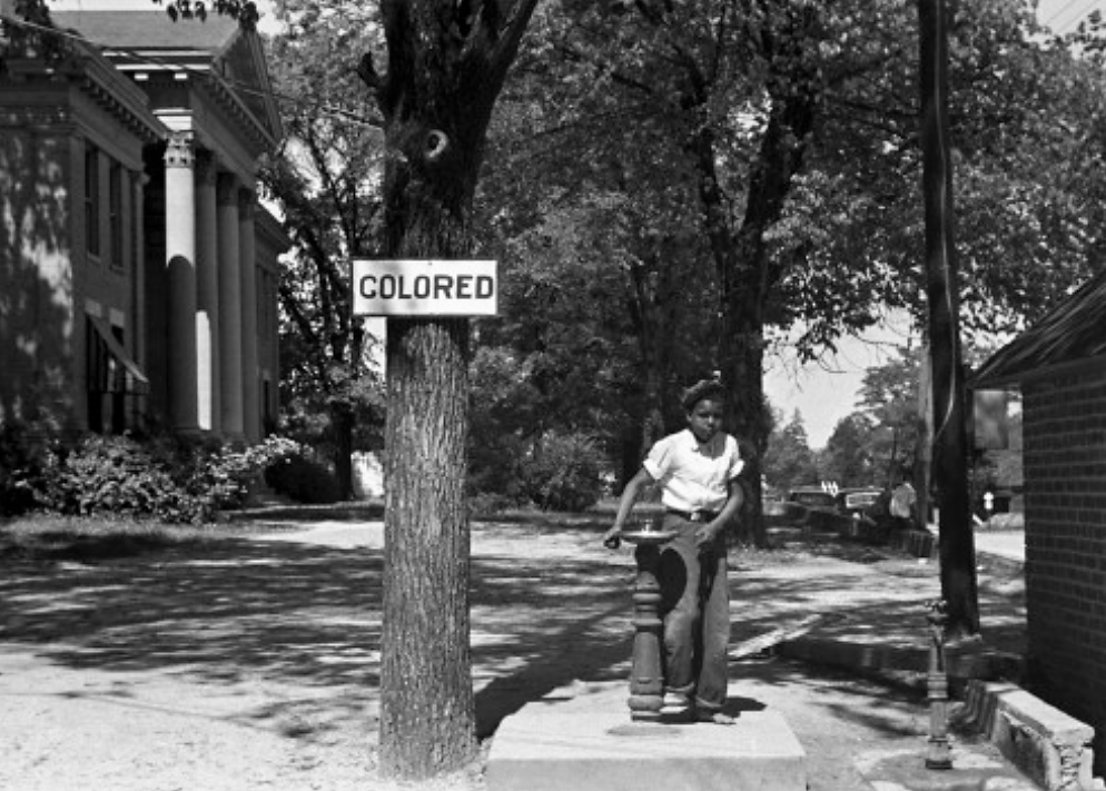 Segregation extended beyond private business property; this segregated drinking fountain was located on the ground of the Halifax county courthouse in North Carolina. Photograph, April 1938. Wikimedia, http://commons.wikimedia.org/wiki/File:Segregation_1938b.jpg.