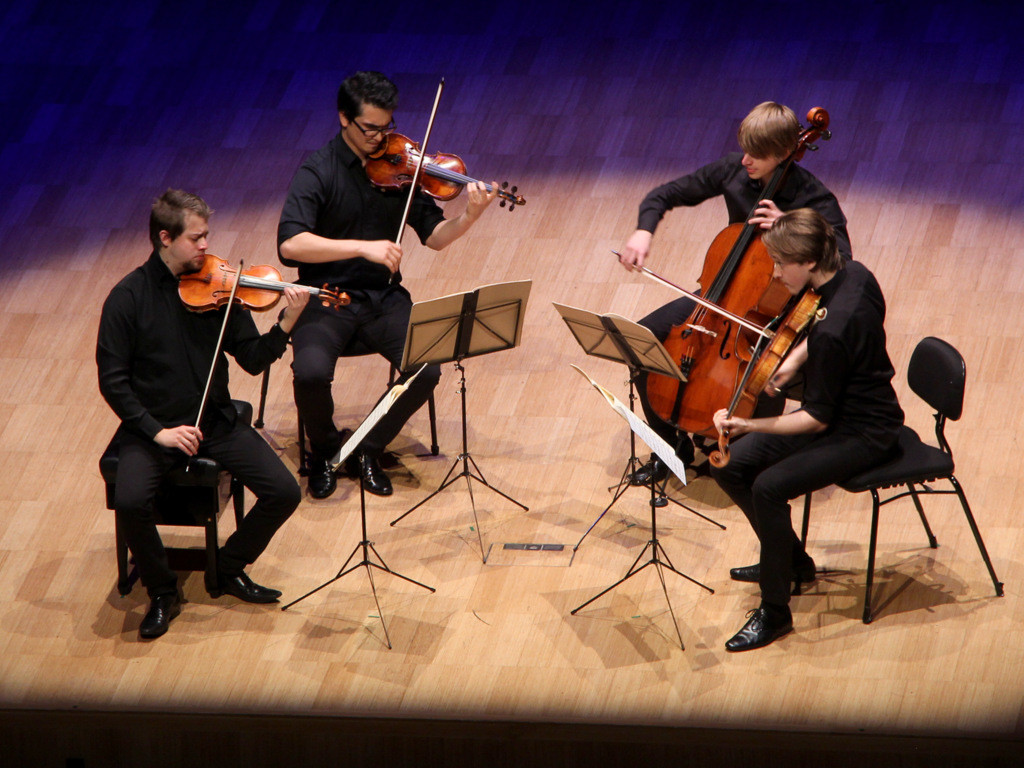 Photo of the Orava Quartet onstage.