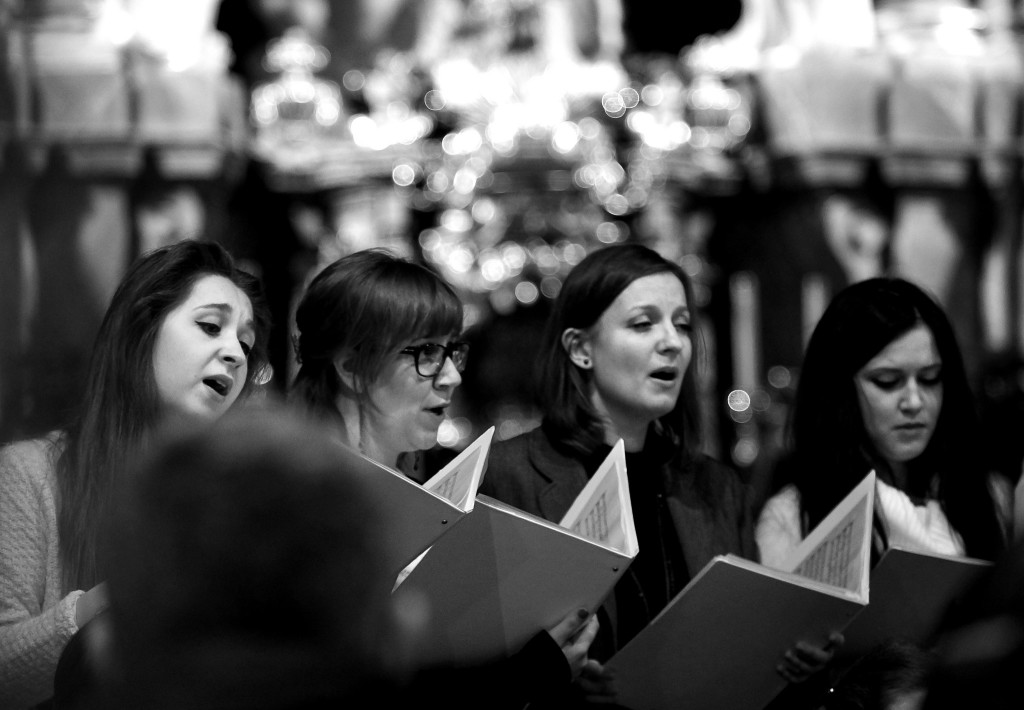 Black-and-white photo of women singing in a choir.