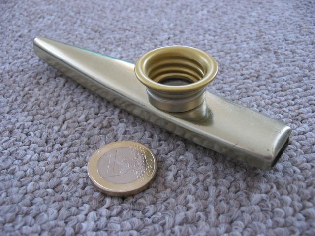 A metal kazoo with a 1 Euro coin for comparison: 23.25 mm (0.92 inch)