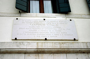 Photo of a commemorative plaque beside the Ospedale della Pietà bearing Antonio Vivaldi's name.