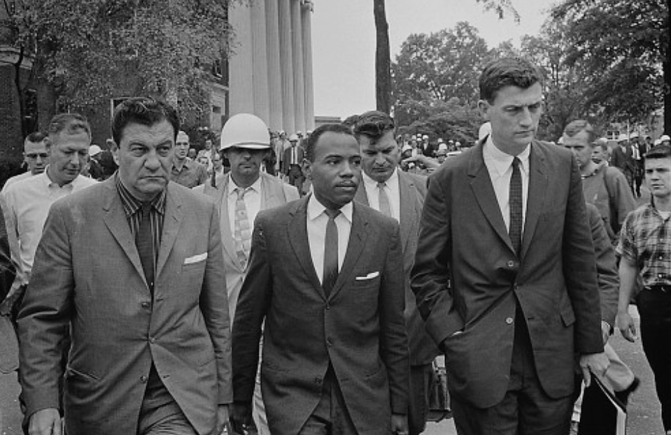 James Meredith, accompanied by U.S. Marshalls, walks to class at the University of Mississippi in 1962. Meredith was the first African-American student admitted to the still segregated Ole Miss. Marion S. Trikosko, “Integration at Ole Miss[issippi] Univ[ersity],” 1962. Library of Congress, http://www.loc.gov/pictures/item/2003688159/.