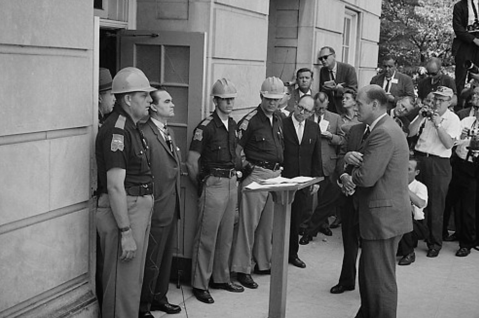 Alabama governor George Wallace stands defiantly at the door of the University of Alabama, blocking the attempted integration of the school. Wallace was perhaps the most notoriously pro-segregation politician of the 1960s, proudly proclaiming in his 1963 inaugural address “segregation now, segregation tomorrow, segregation forever.” Warren K. Leffler, “[Governor George Wallace attempting to block integration at the University of Alabama],” June 11, 1963. Library of Congress, http://www.loc.gov/pictures/item/2003688161/.
