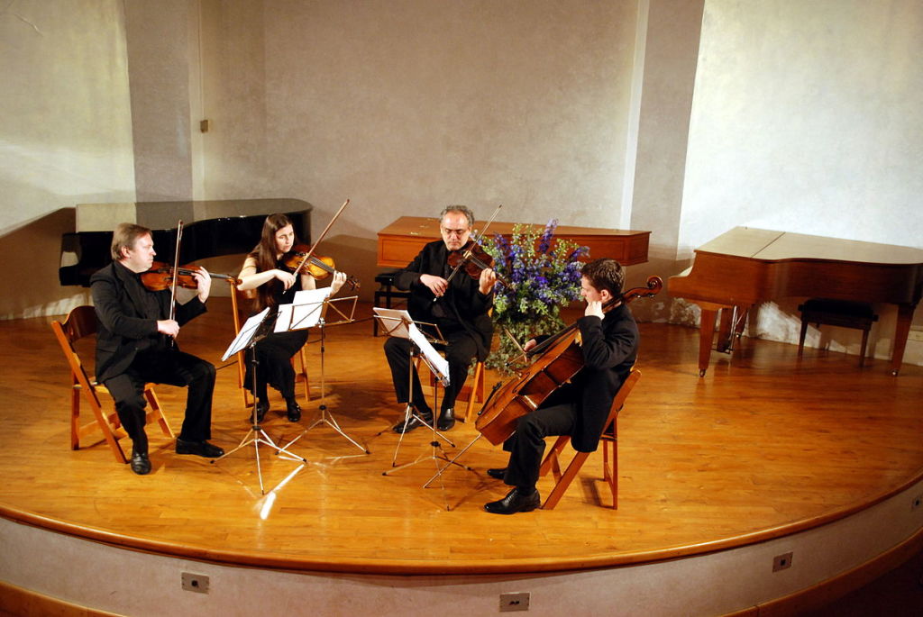 Figure 1. A string quartet in performance. From left to right—violin 1, violin 2, viola, cello