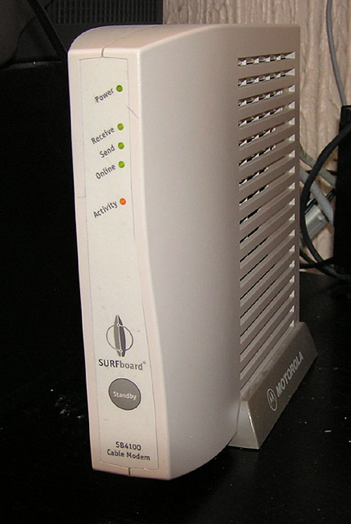 Cable modem Motorola SurfBoard for broadband internet. It is a small independently standing box.