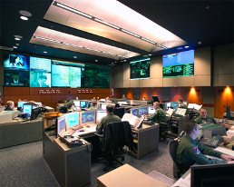 This image depicts employees working at a fusion center.