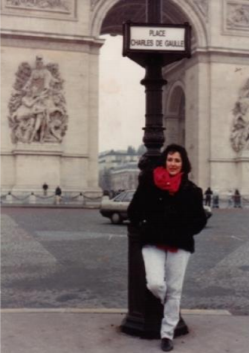 A woman standing in the Place Charles de Gaulle in Paris, France.