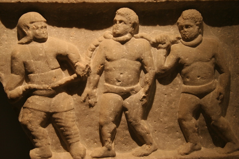 Roman collared slaves, marble relief, Smyrna (present day Izmir, Turkey), 200 A.D., courtesy of the Ashmolean Museum.