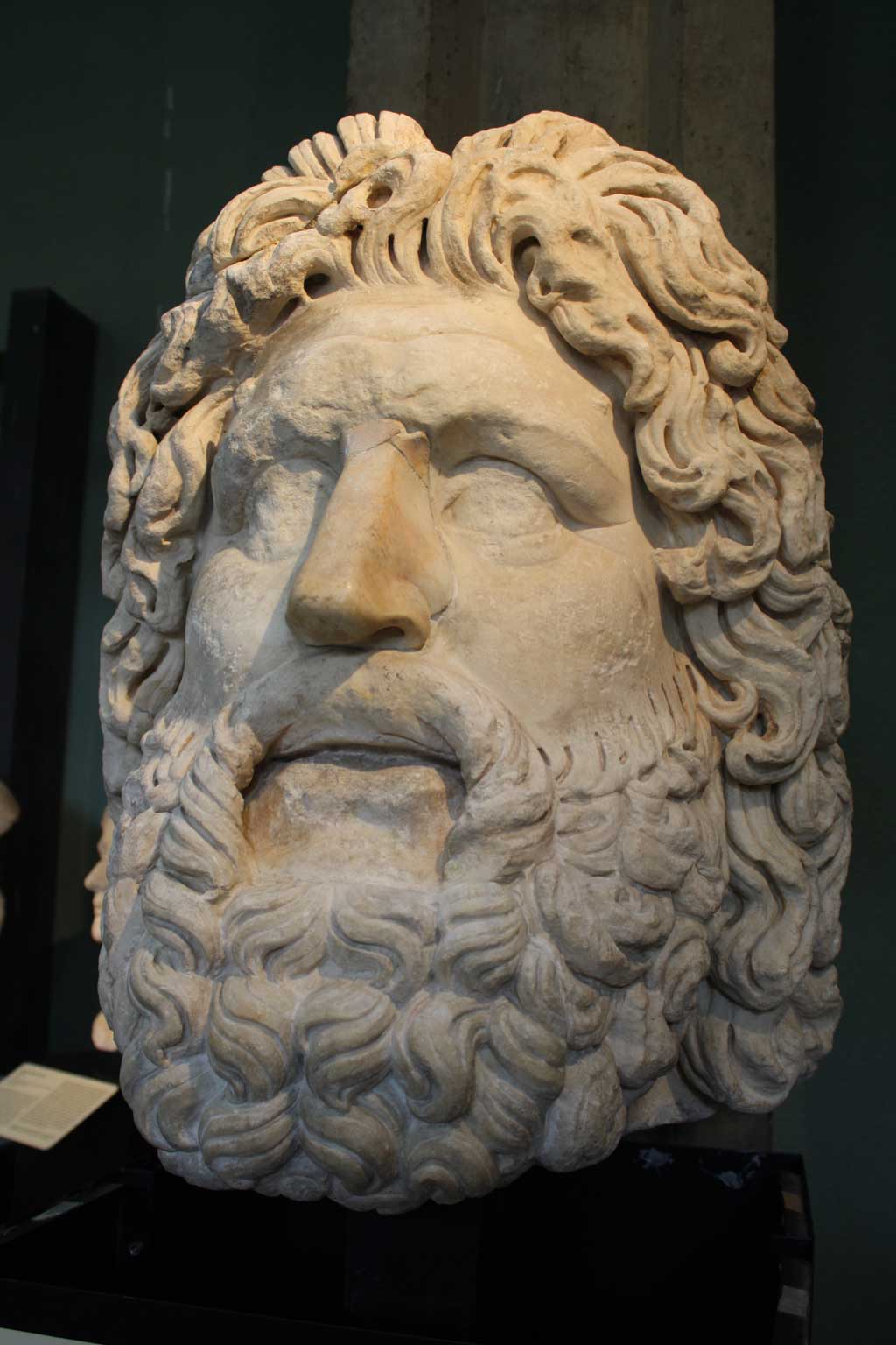 Picture of a marble bust of the bearded Roman god Jupiter